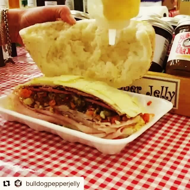 Muffaletta #slomo, courtesy of @bulldogpepperjelly…Thanks ladies! #Repost ・・・ @calandrosmkt muffaletta topped with Roasted Garlic Bulldog…